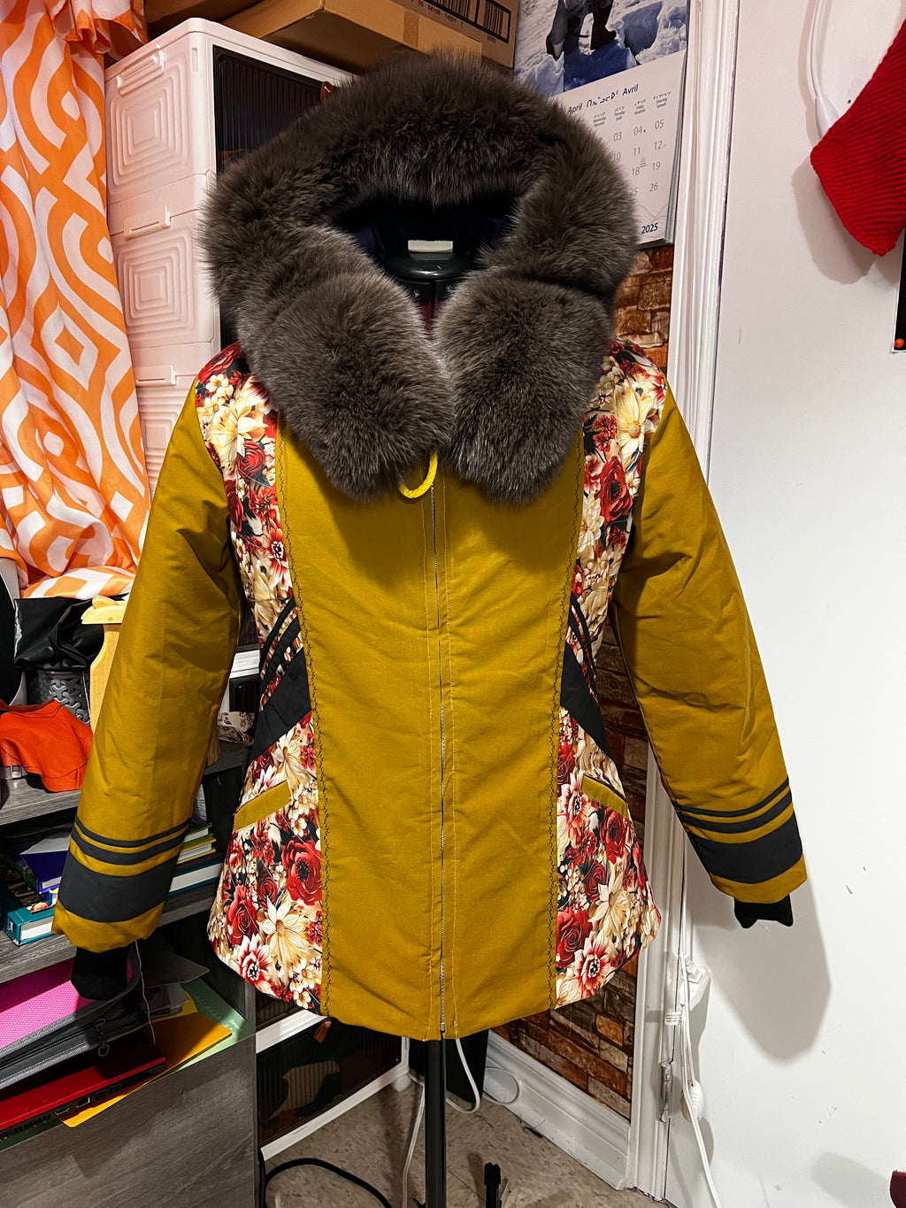 mustard yellow parka, floral designs with brown fox fur