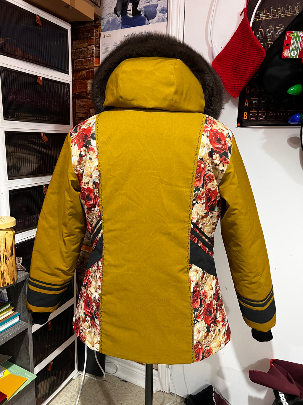mustard yellow parka, floral designs with brown fox fur